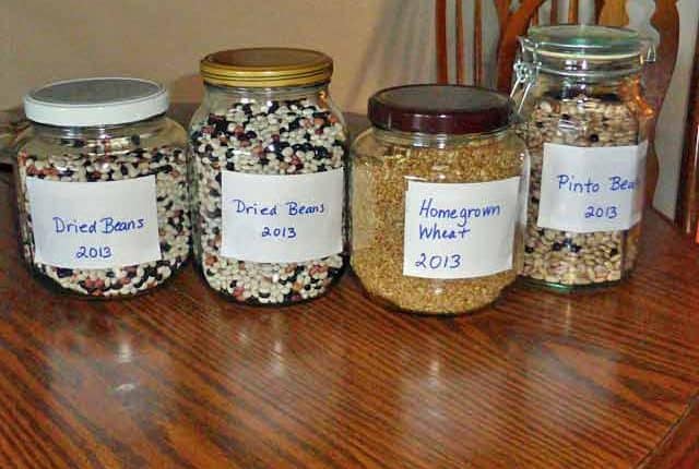 A table with four jars of food on it.