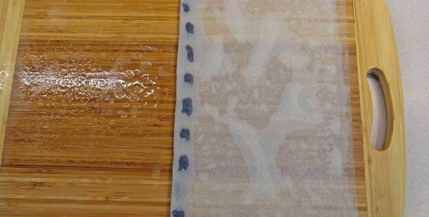 A close up of the wood floor with a blue strip