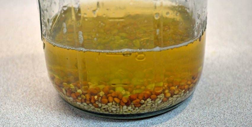 A glass bowl filled with liquid on top of a table.