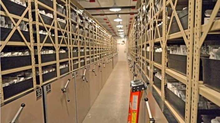 USDA Cold Vault A long hallway with many shelves of books.