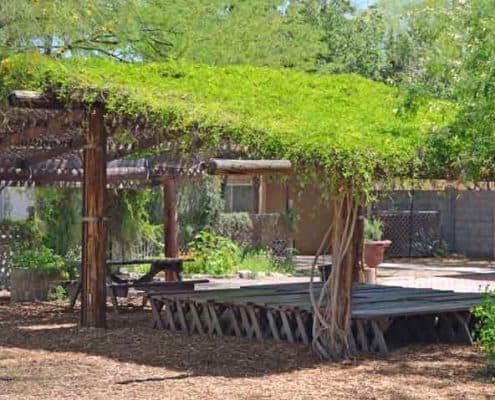 A wooden structure with grass on top of it.