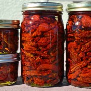A group of jars filled with food on top of a table.