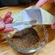Hand Packing Seeds with Scoop